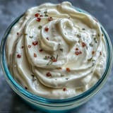 A jar of homemade mayonnaise in 5 minutes, rich and glossy, made with an immersion blender.