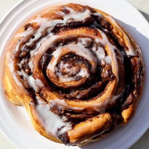 A close-up of soft and fluffy cinnamon rolls, swirled beautifully and promising sweetness.